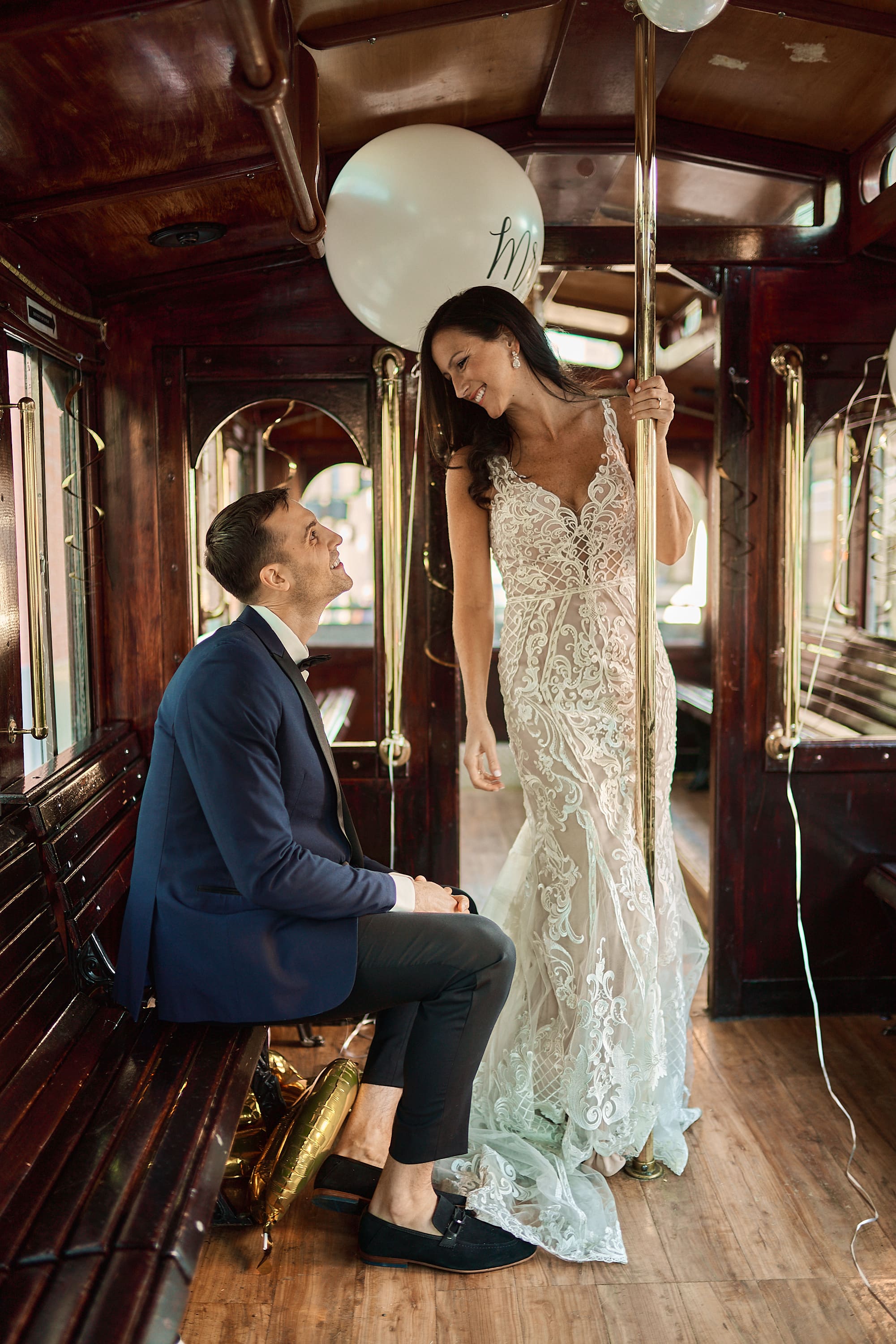 Moody portrait of a couple inside a vintage train car in Boston